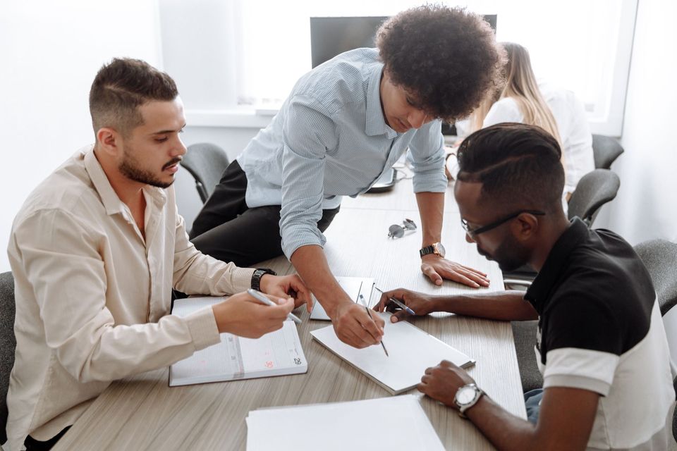 Small team working together at an office table