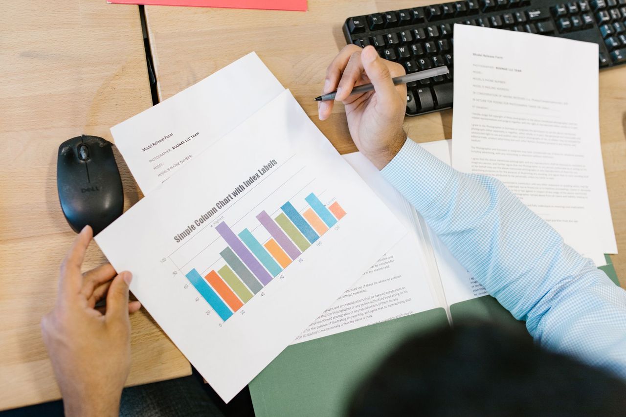 Reviewing a printed report with charts