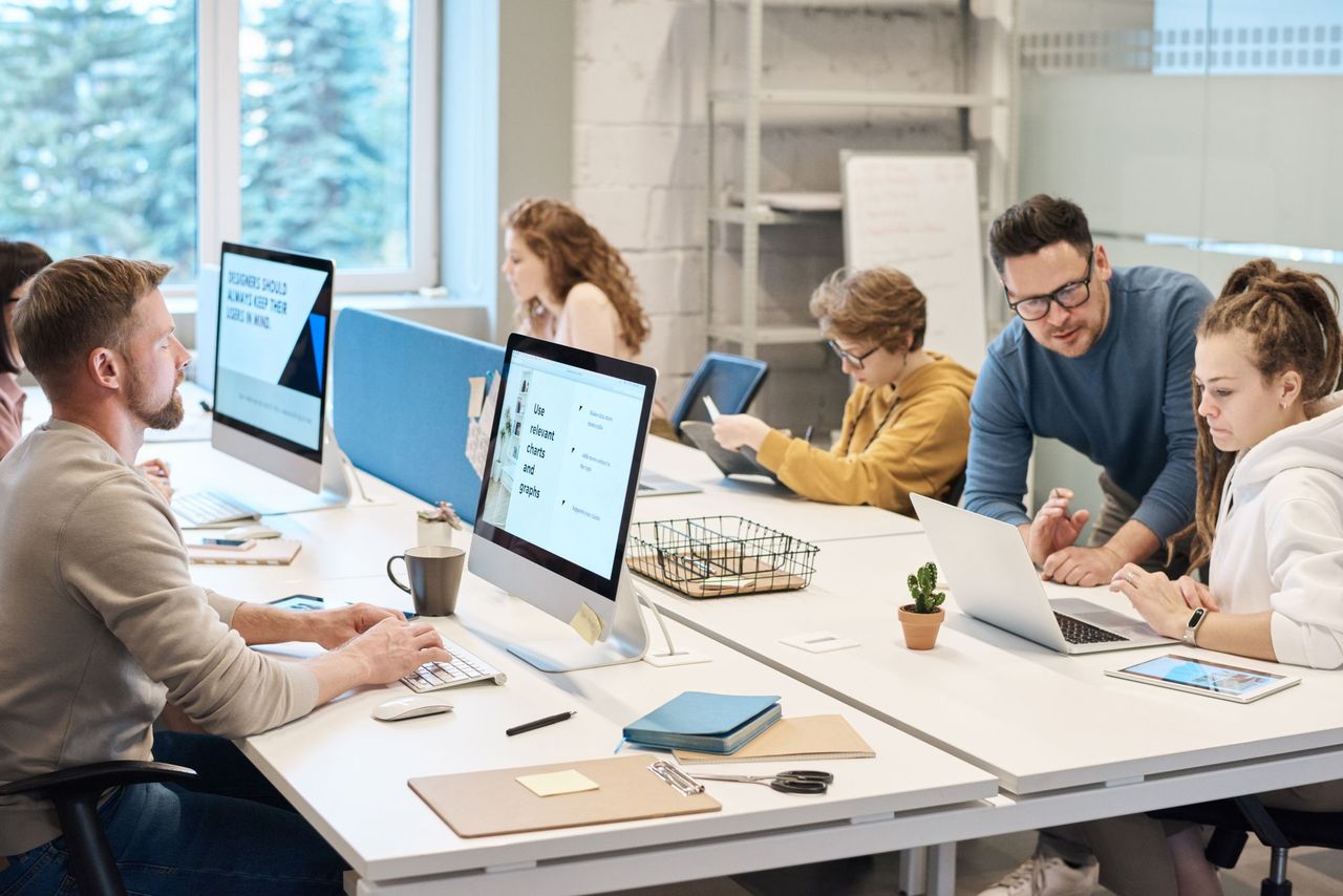 Small business team at work in a bright office